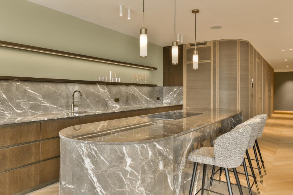 Elegant marble kitchen island with seating and contemporary cabinetry design